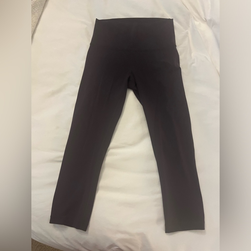 Very dark purple lululemon capri leggings.